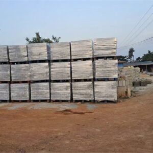 Pallets of finished concrete blocks stacked across the Quasi yard