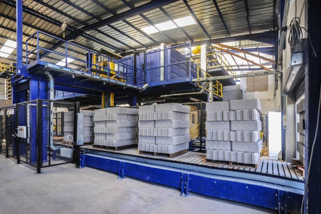 Concrete block production line with pallets of freshly moulded blocks