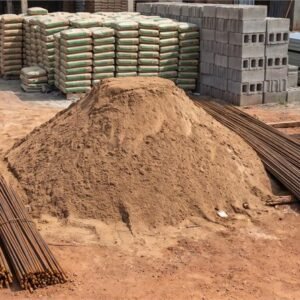 Building materials yard with cement, sand, blocks and reinforcement bars
