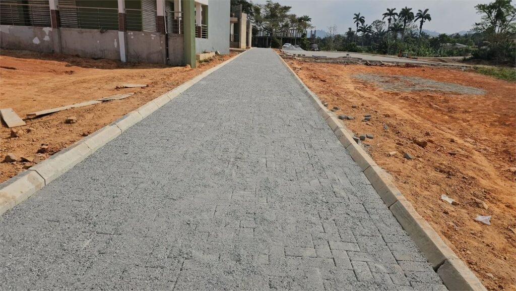 Completed pavement block access road with kerbs