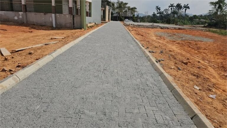 Completed pavement block access road with kerbs